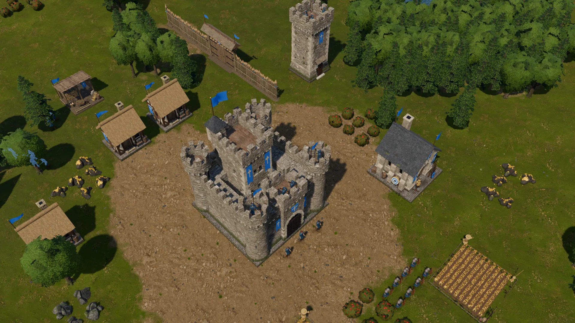 Base humana vista desde arriba: centro de mando de piedra, casas, una granja, una torre, un tramo de muro de madera y unidades en formación.